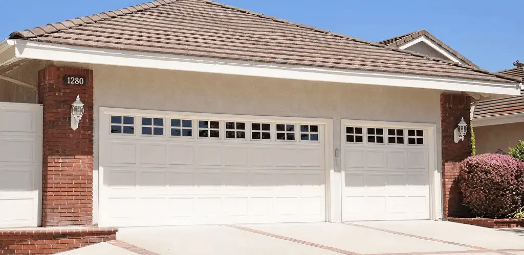 Residential garage door repair service for a double garage door in Bellevue, WA