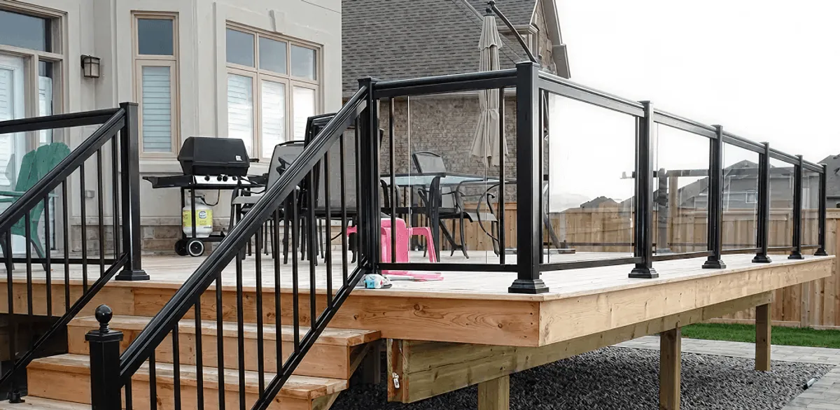 Handrail installation on a deck staircase for safety and code compliance in Bellevue, WA