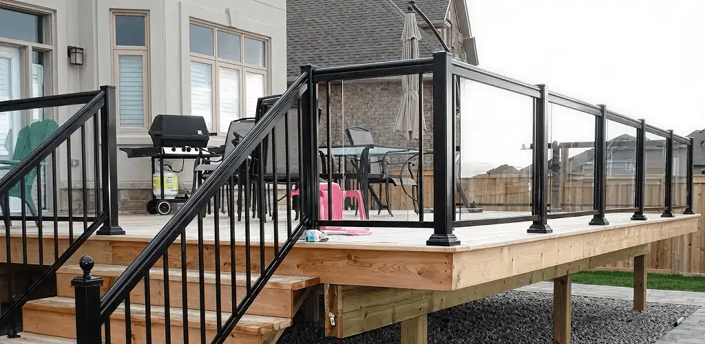 Handrail installation on a deck staircase for safety and code compliance in Bellevue, WA